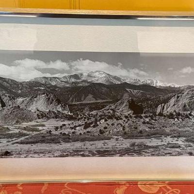 Pikes peak towering over the garden of the gods" artist unknown