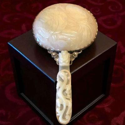 A white jade mounted silver hand mirror