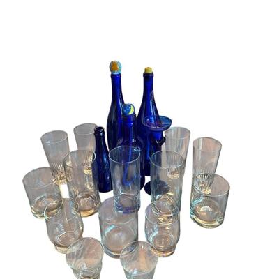 Crystal Glasses And Blue Wine Bottles With Painted Corks