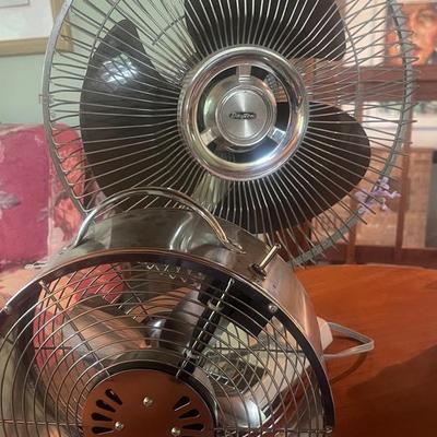 Two table fans different sizes 