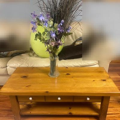 Brown Oak Coffee Table And Vase Of Flowers