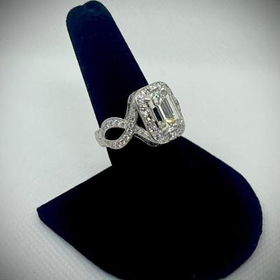 Custom ring: appraisal included on center diamond and one for the ring itself. 

Emerald cut dia. 3.87cts. with GIA clarity,...