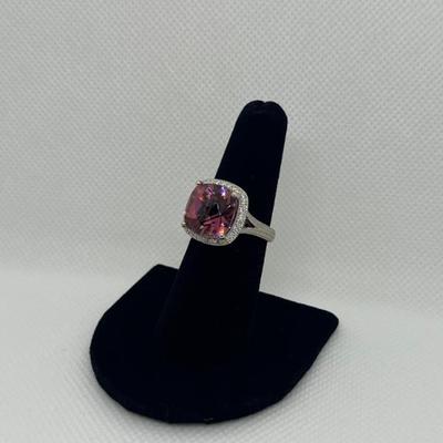 Sale Photo Thumbnail #202: 14k gold with synthetic tourmaline in a halo of 0.25cts "G-H" color, "SI-1I" clarity. Appraisal included.  $600.00
