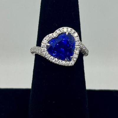 Sale Photo Thumbnail #212: Designer: Bruno Crivelli, Blue heart Sri Lanka sapphire (graded & certified with HKD report, included) with a halo of 94 diamonds 0.64cts, "G-H" color, "VS" clarity. Appraisals included. $12,500.00