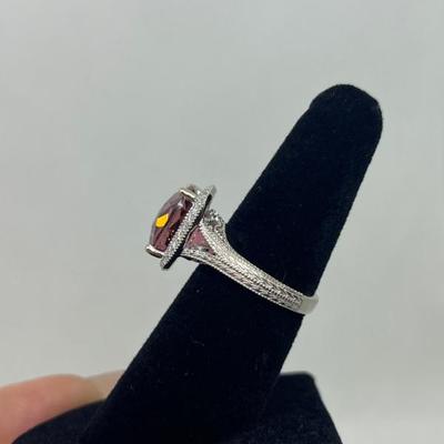 Sale Photo Thumbnail #201: 14k gold with synthetic tourmaline in a halo of 0.25cts "G-H" color, "SI-1I" clarity. Appraisal included.  $600.00