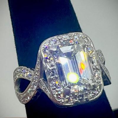 Custom ring: appraisal included on center diamond and one for the ring itself. 

Emerald cut dia. 3.87cts. with GIA clarity,...