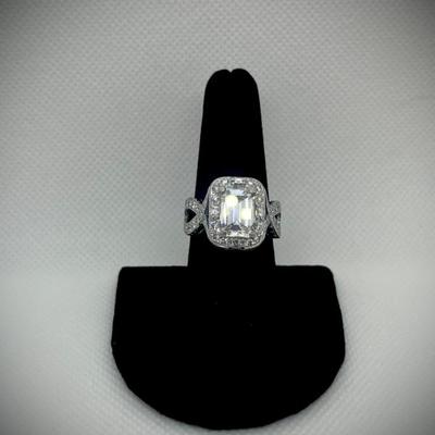 Custom ring: appraisal included on center diamond and one for the ring itself. 

Emerald cut dia. 3.87cts. with GIA clarity,...