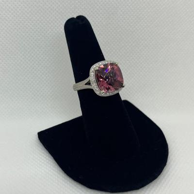 Sale Photo Thumbnail #199: 14k gold with synthetic tourmaline in a halo of 0.25cts "G-H" color, "SI-1I" clarity. Appraisal included.  $600.00