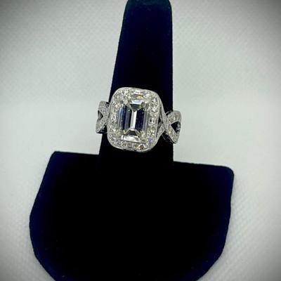 Custom ring: appraisal included on center diamond and one for the ring itself. 

Emerald cut dia. 3.87cts. with GIA clarity,...