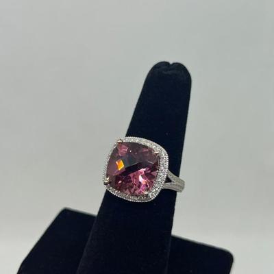 Sale Photo Thumbnail #200: 14k gold with synthetic tourmaline in a halo of 0.25cts "G-H" color, "SI-1I" clarity. Appraisal included.  $600.00