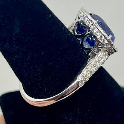 Sale Photo Thumbnail #208: Designer: Bruno Crivelli, Blue heart Sri Lanka sapphire (graded & certified with HKD report, included) with a halo of 94 diamonds 0.64cts, "G-H" color, "VS" clarity. Appraisals included. $12,500.00