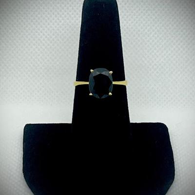 Ink sapphire in 14k gold band 