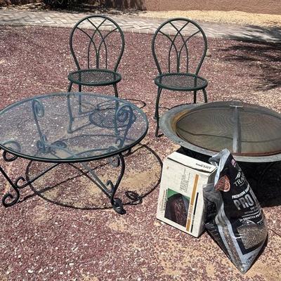 Fire Pit, Glass Table, And Two Chairs