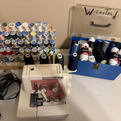 Lot 214: New Home Serger And Thread