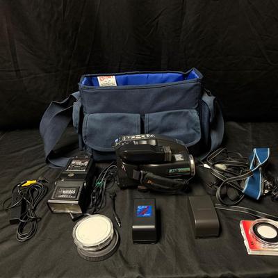 Lot 454: Panasonic Palmcorder VHS-C Camcorder Kit – 750x Digital Zoom, Accessories & Carry Case