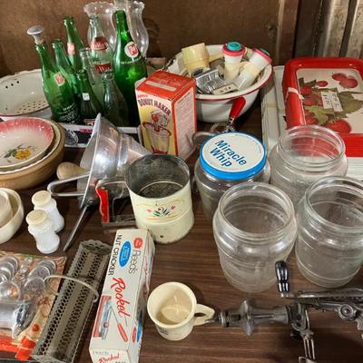 Vintage glass bottles and jars; midcentury baking tools