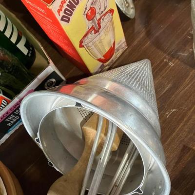 Vintage sieve with wooden pestle and stand