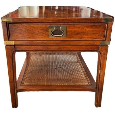 Wood-like end table with brassy details 