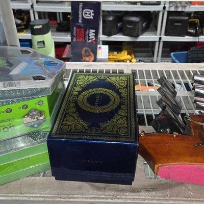 2342 • versace cologne travel set, boat shaped clock & more