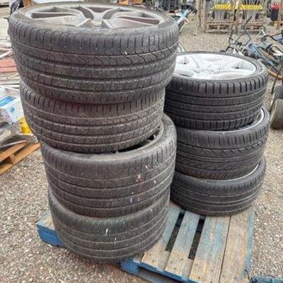 80004 • (7) tires with wheels on pallet