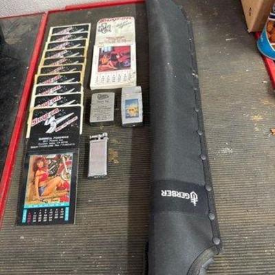 #1258 • 11 Snap On Pin Up Calendars, 3 Lighters, 1 Machete
