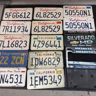 #2542 • 12 License Plates and 4 License Plate Covers
