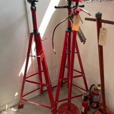 #1710 • (2) 2 Ton High-Position Hoist stands, (1) 3/4 Ton Hoist Stand, And a Grease Gun
