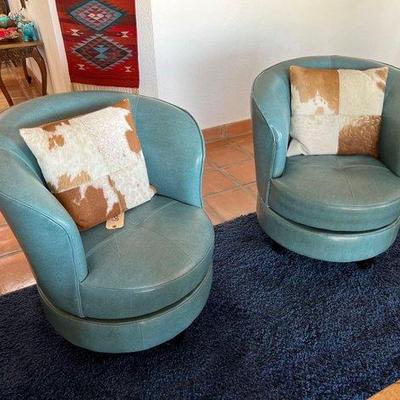 #6300 • (2) Swivel Chairs with (2) Cowhide throw pillows
