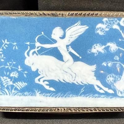 Ceramic lidded box cupid with arrow riding a goat