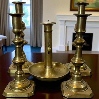 Five antique english brass candle sticks