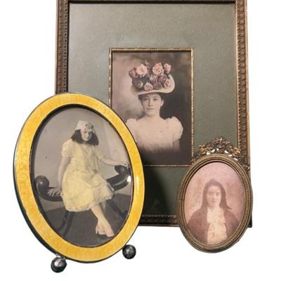 Trio of framed portraits