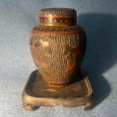 Chinese carved vase on wood pedestal for display