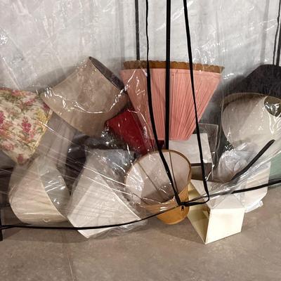 Plastic Closet Unit Filled With Lamp Shades