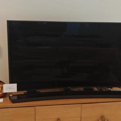 Sale Photo Thumbnail #9: 65" curved Samsung Smart TV with soundbar and woofer included