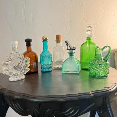 7 Colored Glass Bottles, Decanters, and Pitcher