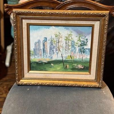 Framed Artwork of Park Scene with City Skyline