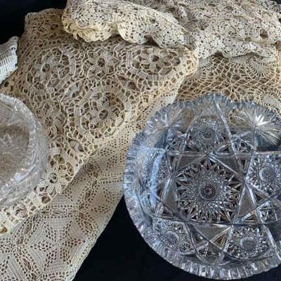 Kg195 crocheted table cloths and cut glassware