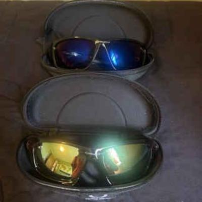 2 pairs of oakley sunglasses