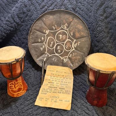 Pair of djembe drums and a steelpan drum