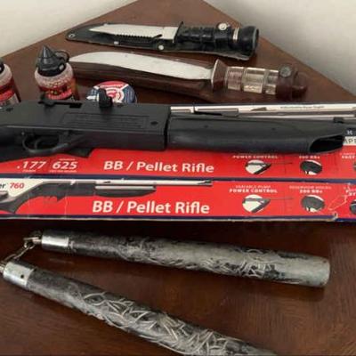 Survival knives pellet gun, nun chucks and a dart board!