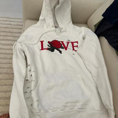 Love sweat shirt White by heart and Sole .  It was designed with holes