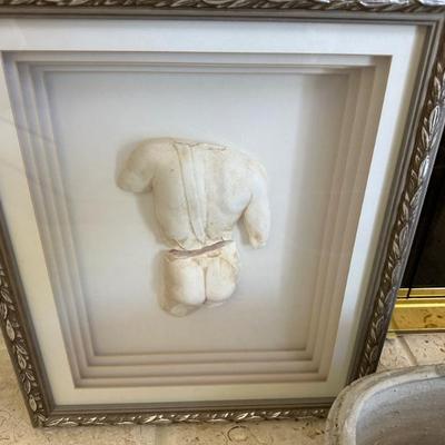sculpture in a frame