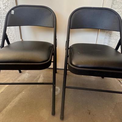 Two Fold Up Chairs W/ Black Cushy Seats 