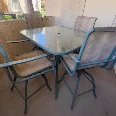 Glass High-Top Patio Table And Four Chairs