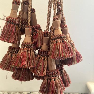 (8pc) Collection of Decorative Tassels | Collection of decorative tassels with braided cords, cylindrical centers wrapped in intricate...