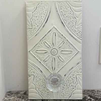 Decorative Coat Hanger/Wall Hook | Decorative coat hanger/wall hook with an ornate sunburst-like central motif, surrounded by textured...