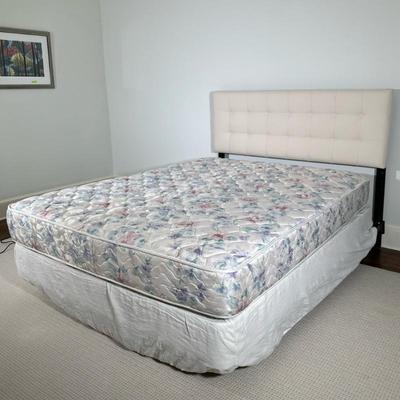 White Tufted Headboard/Bed - Queen-Sized | Queen-sized bed featuring a white tufted upholstered headboard, along with metal bedframe on...
