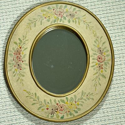 Hand-Painted Oval Wall Mirror | Vintage-style oval wall mirror with a hand-painted floral design on the frame. - h. 16.5 x w. 15 in
