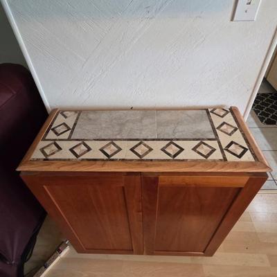 Tile Top Cabinet with 2 adjustable shelves~~Exterior: 31 in wide X 33 in tall X 14 in deep