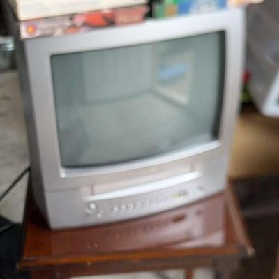 16” Toshiba TV/VCR, 8 VHS tapes & Table